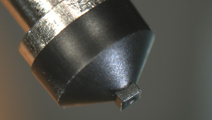 Rubber tip for die pickup